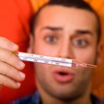 temperature without cold symptoms in an adult