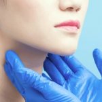 Doctor examining a patient&#39;s neck